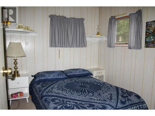 5268 Machete Lake Road, Bridge Lake, BC - Indoor Photo Showing Bedroom