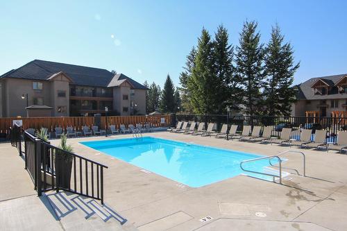 812D - 800 Bighorn Boulevard, Radium Hot Springs, BC - Outdoor With In Ground Pool With Backyard