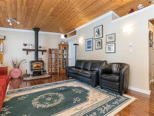 91 Bald Eagle Cres, Bowser, BC - Indoor Photo Showing Living Room With Fireplace