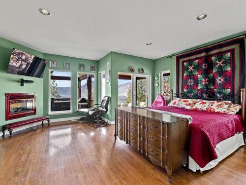 1890 Coldwater Drive, Kamloops, BC - Indoor Photo Showing Bedroom With Fireplace