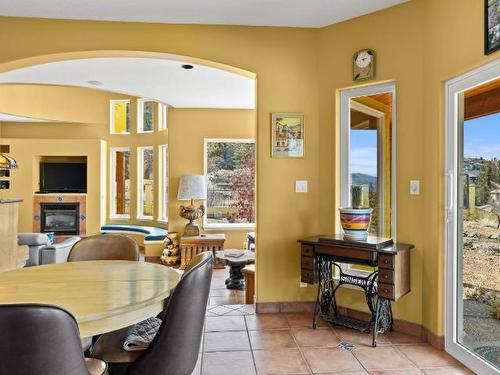 1890 Coldwater Drive, Kamloops, BC - Indoor Photo Showing Dining Room With Fireplace