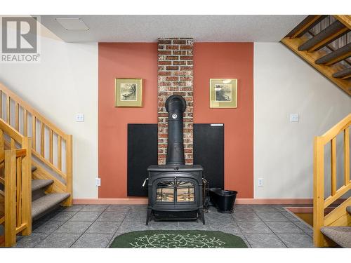 205 Monashee Road, Silver Star, BC - Indoor Photo Showing Other Room With Fireplace