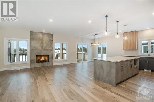 Some photos are virtually staged/digitally altered and NOT the home for sale - similar model by same builder - 178 Danika Street, Hammond, ON - Indoor With Fireplace