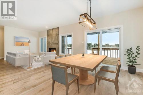 Some photos are virtually staged/digitally altered and NOT the home for sale - similar model by same builder - 178 Danika Street, Hammond, ON - Indoor Photo Showing Dining Room With Fireplace