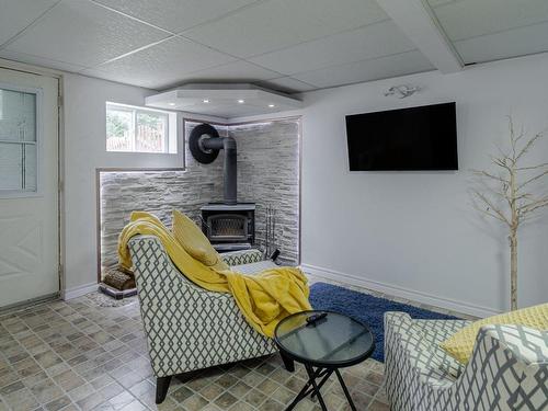 Salle familiale - 820 Rue Lessard, Saint-René, QC - Indoor With Fireplace