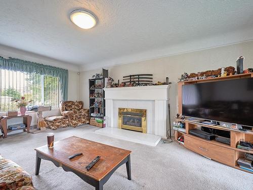 150 Corfield St North, Parksville, BC - Indoor Photo Showing Living Room With Fireplace