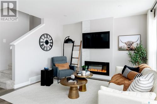 282 Schmeiser Bend, Saskatoon, SK - Indoor Photo Showing Living Room With Fireplace