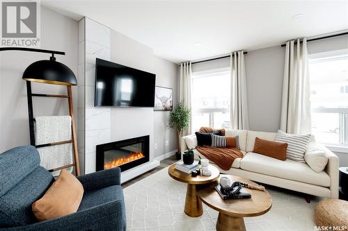 282 Schmeiser Bend, Saskatoon, SK - Indoor Photo Showing Living Room With Fireplace