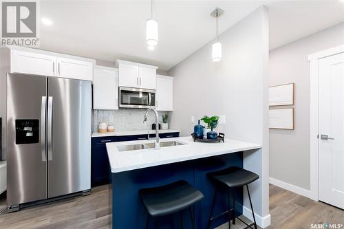 306 Schmeiser Bend, Saskatoon, SK - Indoor Photo Showing Kitchen With Stainless Steel Kitchen With Double Sink
