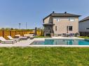 Piscine - 3124 Rue Édouard-Harbec, Carignan, QC  - Outdoor With In Ground Pool With Backyard 