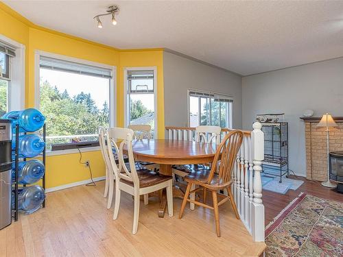 6006 Sunset Rd, Nanaimo, BC - Indoor Photo Showing Dining Room With Fireplace