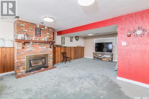 801 V Avenue N, Saskatoon, SK - Indoor Photo Showing Living Room With Fireplace