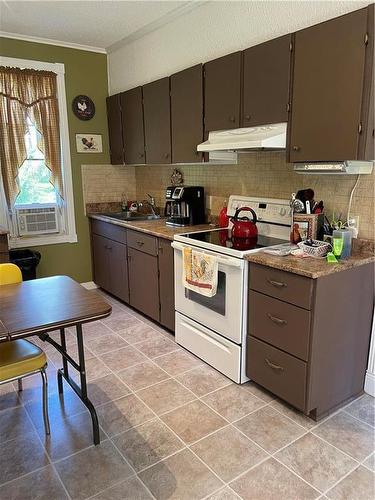 477 93N Road, Shoal Lake, MB - Indoor Photo Showing Kitchen With Double Sink