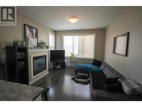 1634 88 Avenue, Dawson Creek, BC - Indoor Photo Showing Living Room With Fireplace