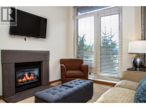 2950 Camozzi Road Unit# 1212, Revelstoke, BC - Indoor Photo Showing Living Room With Fireplace