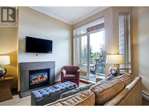 2950 Camozzi Road Unit# 1212, Revelstoke, BC - Indoor Photo Showing Living Room With Fireplace