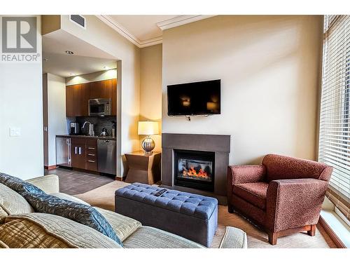 2950 Camozzi Road Unit# 1212, Revelstoke, BC - Indoor Photo Showing Living Room With Fireplace