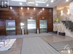 grand lobby with 3 elevators - 