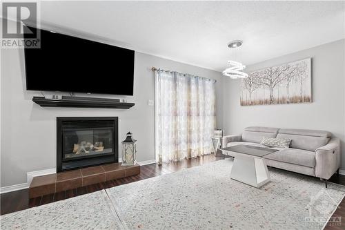5 Marcay Street, Ottawa, ON - Indoor Photo Showing Living Room With Fireplace