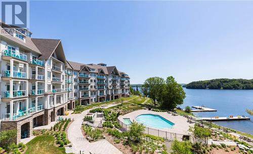 425 - 25 Pen Lake Point Road, Huntsville, ON - Outdoor With Body Of Water With In Ground Pool With Balcony