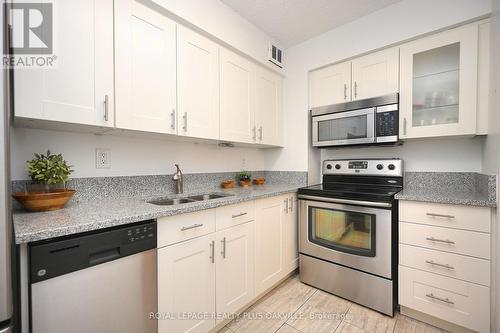 #708 -212 Kerr St, Oakville, ON - Indoor Photo Showing Kitchen With Double Sink