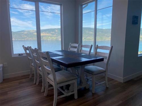 6803 Toledo Drive, Kelowna, BC - Indoor Photo Showing Dining Room With Body Of Water