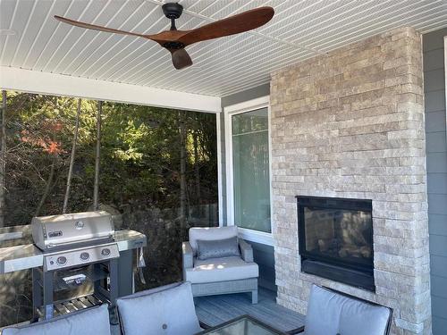 6803 Toledo Drive, Kelowna, BC - Outdoor With Fireplace With Deck Patio Veranda With Exterior