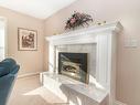 1421 Lombardy Square, Kelowna, BC  - Indoor Photo Showing Living Room With Fireplace 