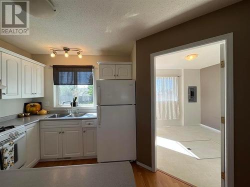 8807-8809 101 Avenue, Fort St. John, BC - Indoor Photo Showing Kitchen With Double Sink