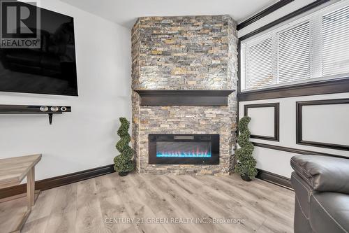113 - 120 Bell Farm Road, Barrie, ON - Indoor Photo Showing Living Room With Fireplace