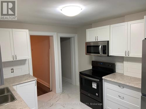 1 - 104 Rosslyn Avenue N, Hamilton, ON - Indoor Photo Showing Kitchen With Double Sink