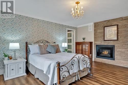 208 Ski Hill Rd, Kawartha Lakes, ON - Indoor Photo Showing Bedroom With Fireplace
