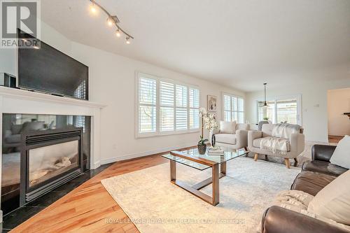 7 Elderberry Crt, Guelph, ON - Indoor Photo Showing Living Room With Fireplace