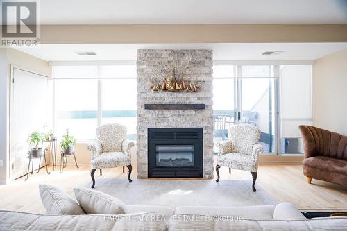 #1704 -75 Ellen St, Barrie, ON - Indoor Photo Showing Living Room With Fireplace