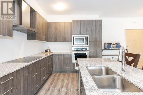 #406 -64 Queen St S, New Tecumseth, ON - Indoor Photo Showing Kitchen With Double Sink With Upgraded Kitchen