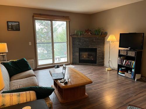 308 - 4874 Stanley Street, Radium Hot Springs, BC - Indoor Photo Showing Living Room With Fireplace