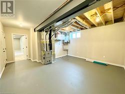 Basement utility room with stairs from the garage - 
