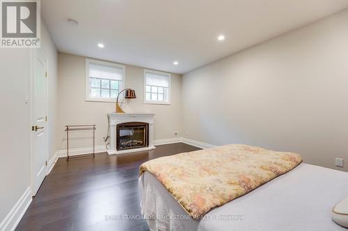 215 Dock Rd, Barrie, ON - Indoor Photo Showing Bedroom With Fireplace