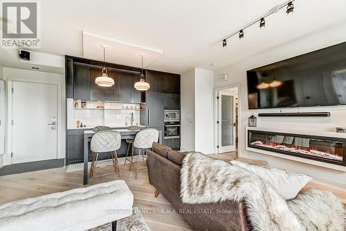 #2406 -80 Western Battery Rd, Toronto, ON - Indoor Photo Showing Living Room With Fireplace