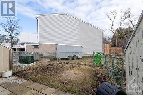 Backyard will soon have a new fence that will provide significantly more privacy. Also, the rear steps will be upgraded. - 825 Cahill Drive Unit#218, Ottawa, ON - Outdoor With Exterior