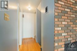 First level hallway provides access to kitchen, living room, and stairs going up and down. - 