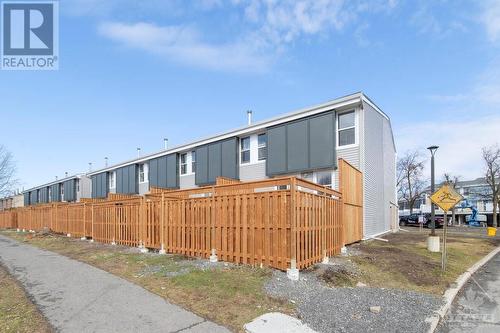 This is a photograph of some neighbouring units that have had the upgraded siding and fencing completed. This will be completed in the near future for unit 218. - 825 Cahill Drive Unit#218, Ottawa, ON - Outdoor