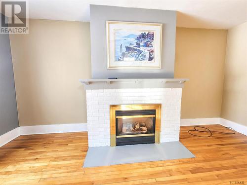 133 Buckingham Ave, Iroquois Falls, ON - Indoor Photo Showing Other Room With Fireplace