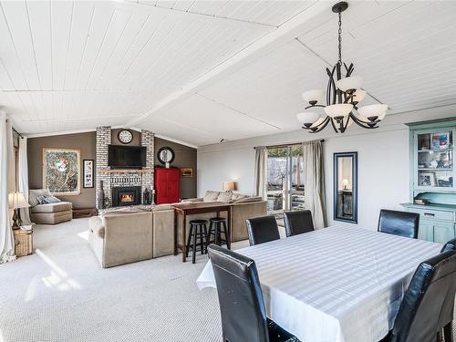 3670 Nautilus Rd, Nanoose Bay, BC - Indoor Photo Showing Dining Room With Fireplace