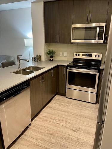 340 Plains Road E|Unit #207, Burlington, ON - Indoor Photo Showing Kitchen With Stainless Steel Kitchen With Double Sink