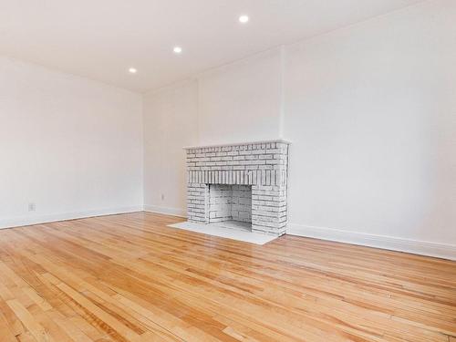 Living room - 69 Rue Dufferin, Hampstead, QC - Indoor With Fireplace