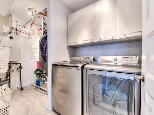 Salle de lavage - 412-14415 Rue Roger-Thomas, Mirabel, QC - Indoor Photo Showing Laundry Room