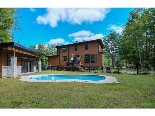 Back facade - 67 Ch. Des Pommiers, Chelsea, QC - Outdoor With In Ground Pool With Backyard