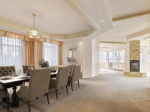 5-9675 First St, Sidney, BC - Indoor Photo Showing Dining Room With Fireplace