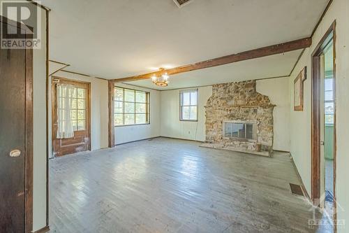 2720 Wylie Road, Glen Robertson, ON - Indoor With Fireplace